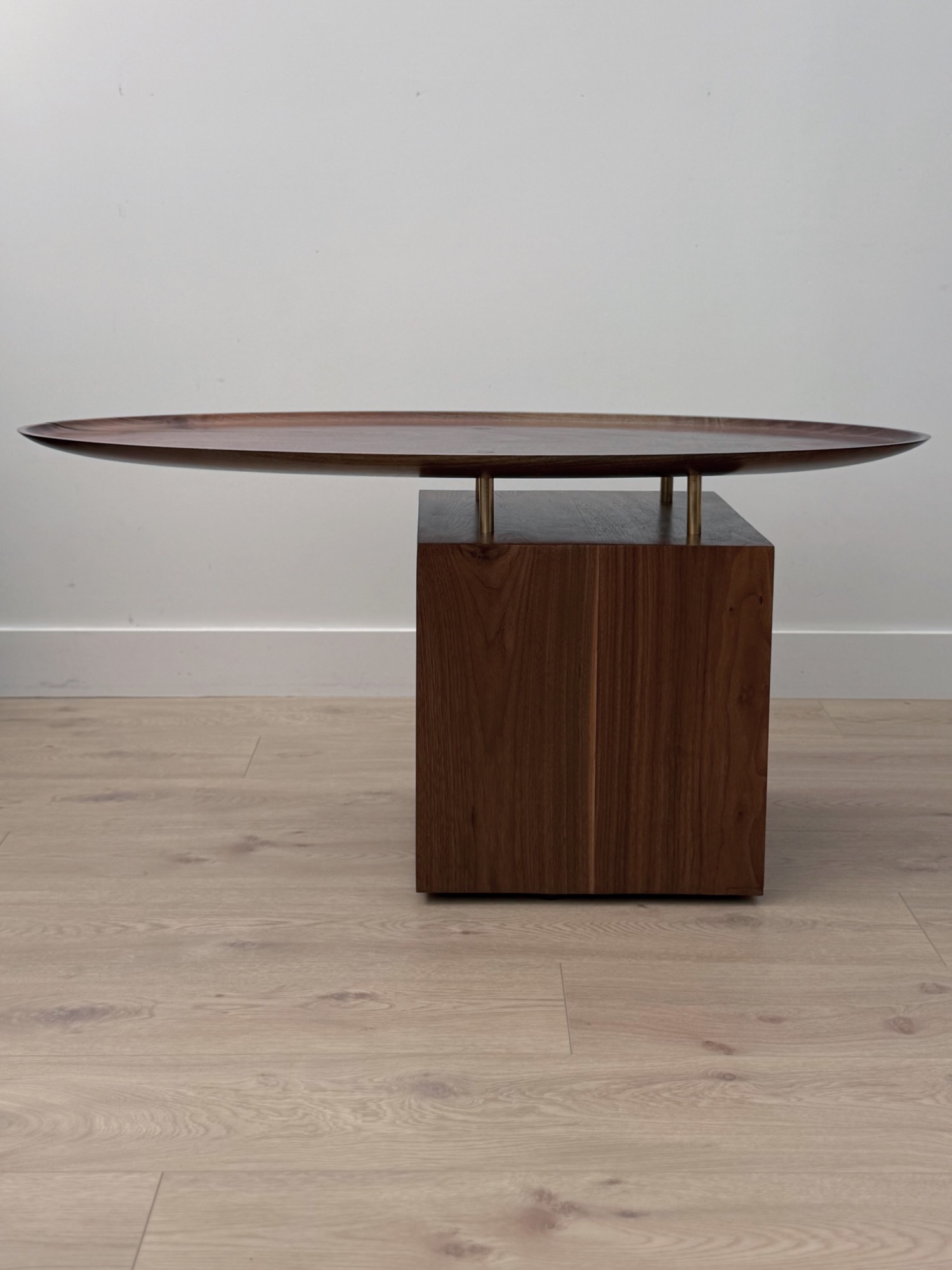 Te Waka o Rangi, the walnut top floating above the cabinet