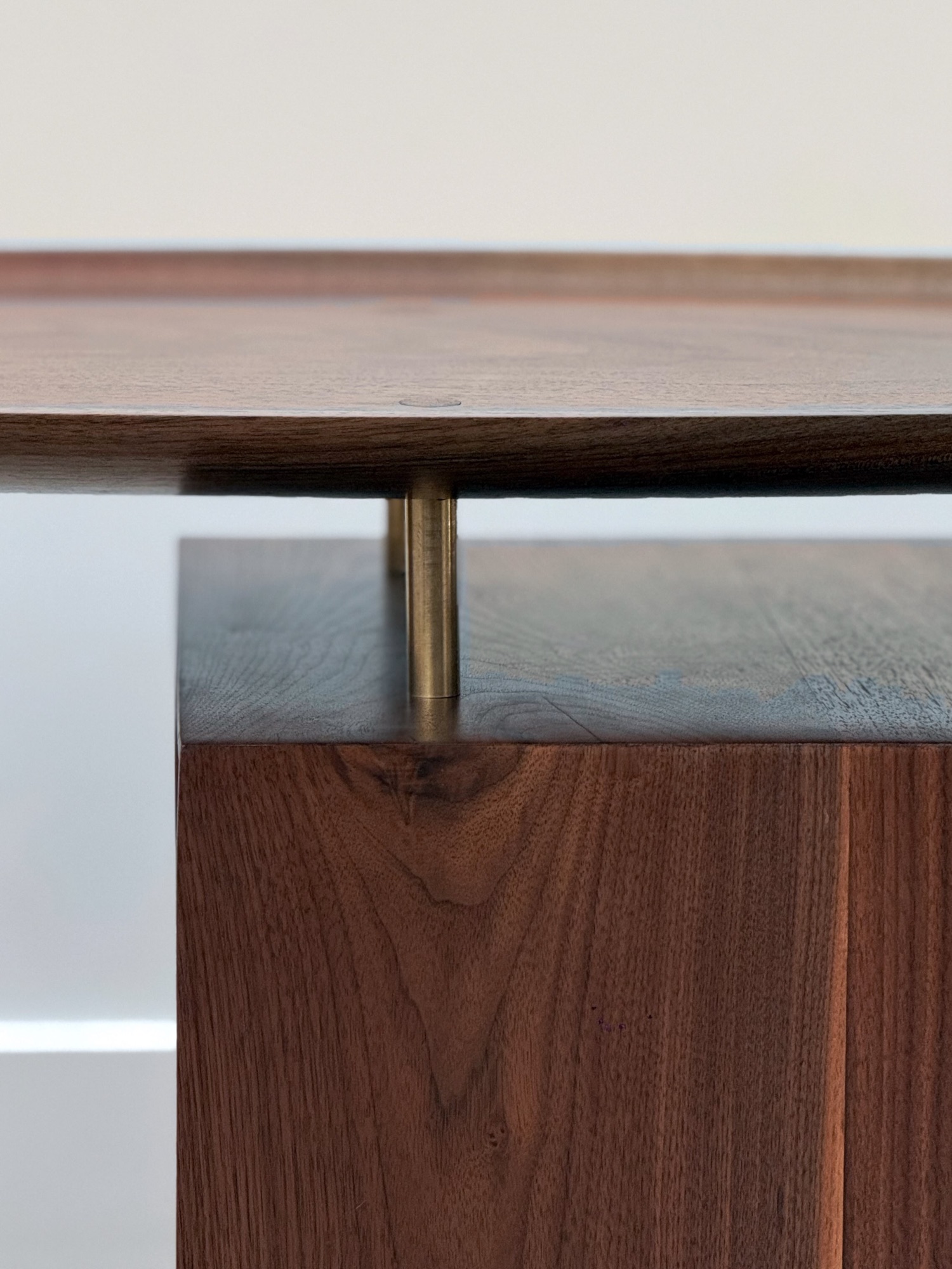 Brass standoff between the top and the cabinet